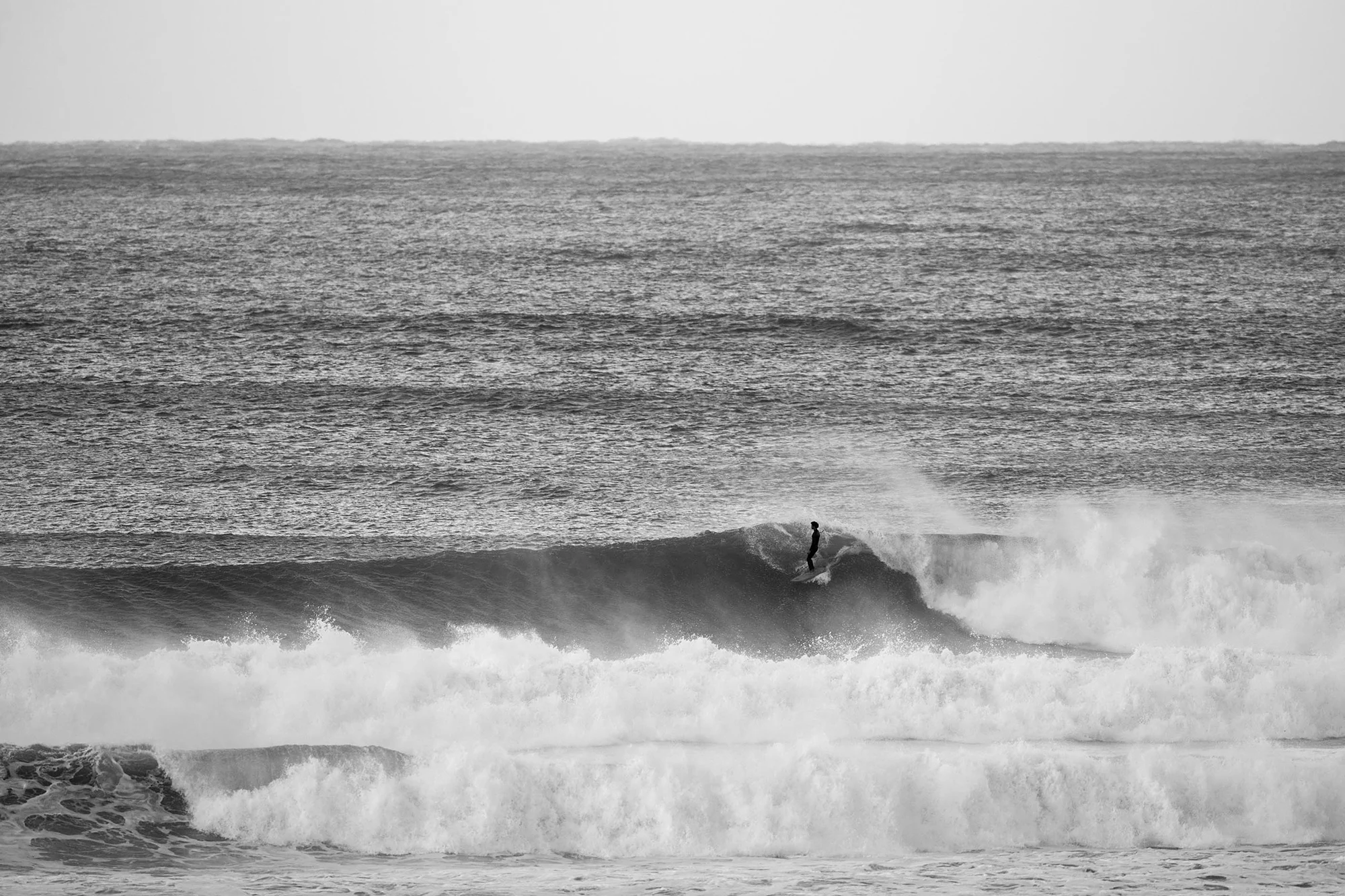 Surfer riding a wave at J-Bay